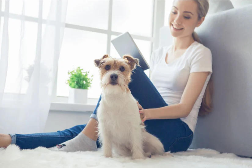 Girl sitting with dog